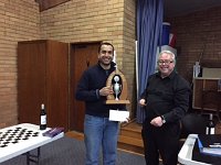 Shum gets the trophy and the Envelope